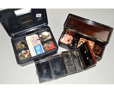 A SELECTION OF JEWELLERY to include a French jet necklace, a red plastic graduated bead necklace, two small cameo brooches, a
