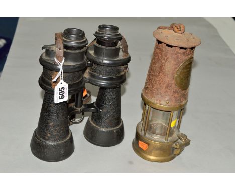 A PAIR OF MILITARY NAVAL BINOCULARS, together with an Eccles Miner's lamp (rusty) (2)