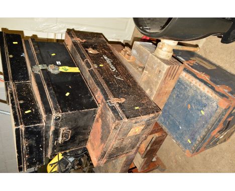 A VINTAGE TRAVELLING TRUNK WITH TRAVEL LABELS, two metal trunks, tin trunk, two deed boxes and a log bucket (7)