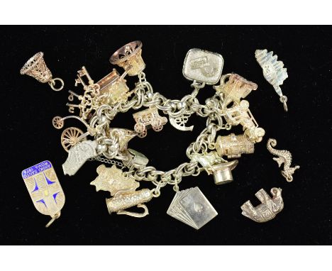 A MID TO LATE 20TH CENTURY SILVER CHARM BRACELET, together with eighteen assorted charms to include a hinged church and hinge