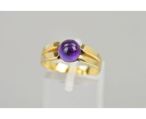 A MODERN SINGLE STONE CABOCHON CUT AMETHYST RING, cabochon measuring approximately 7.10mm in diameter, ring size O, stamped '