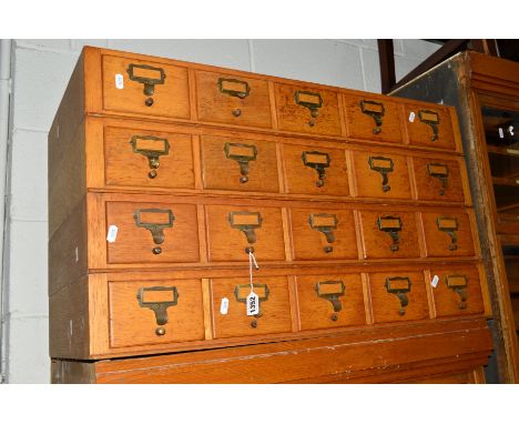 A LIGHT OAK FOUR SECTION HABERDASHERY INDEX CABINET comprising of twenty drawers, approximate width 83.5cm x depth 42cm x hei