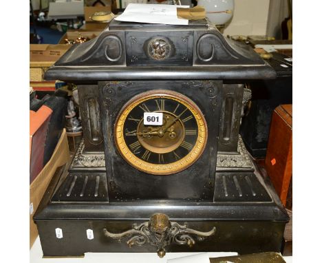 A LATE VICTORIAN BLACK SLATE MANTEL CLOCK OF ARCHITECTURAL FORM, black and gilt dial with Roman numerals, (key and pendulum),