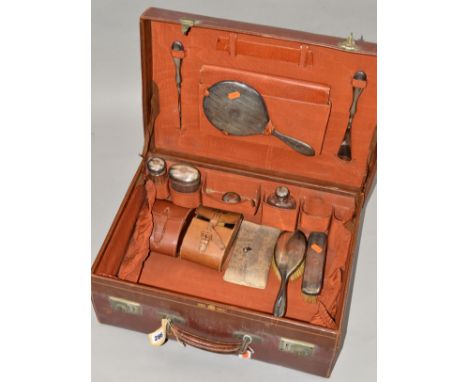 A MAPPIN &amp; WEBB BROWN LEATHER DRESSING CASE, fitted with silver topped glass jars, silver handled accessories, etc, toget