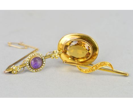 THREE EARLY 20TH CENTURY GOLD BROOCHES, the first of oval outline set with a citrine within a rope twist and plain surround, 