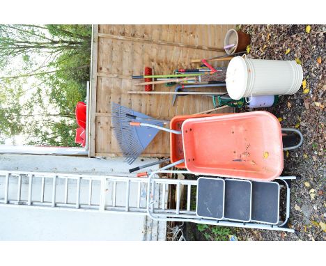 AN ALUMINIUM DOUBLE EXTENSION STEP LADDER, a small step ladder, two plastic wheel barrows, a garden bin and a quantity of gar