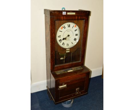 THE GLEDHILL-BROOK TIME RECORDER, an oak cased clocking in machine