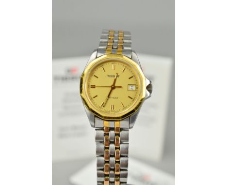 A TISSOT STAINLESS STEEL WRIST WATCH, the gold coloured circular dial with baton hour markers and date dial, gold coloured de