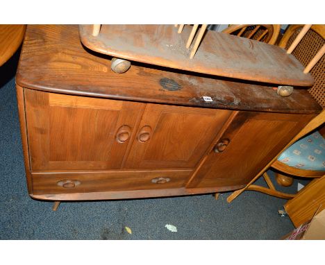 AN ERCOL 1960'S ELM SIDEBOARD with three various cupboard doors and a single drawer on beech legs, approximate width 114cm x 