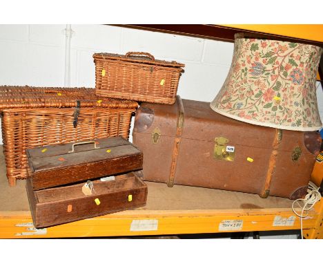 A VINTAGE TRAVELLING TRUNK, two wicker baskets, two wooden trays and a standard lamp (7)