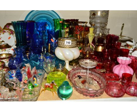 A LARGE QUANTITY OF COLOURED GLASS to include cranberry and blue table lustres and lamp work ornaments, etc