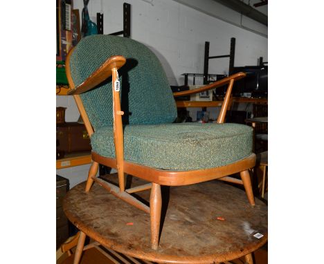 AN ERCOL 1960'S BEECH FRAMED ARMCHAIR and three blonde Ercol stick back chairs (in need of restoration) (4)