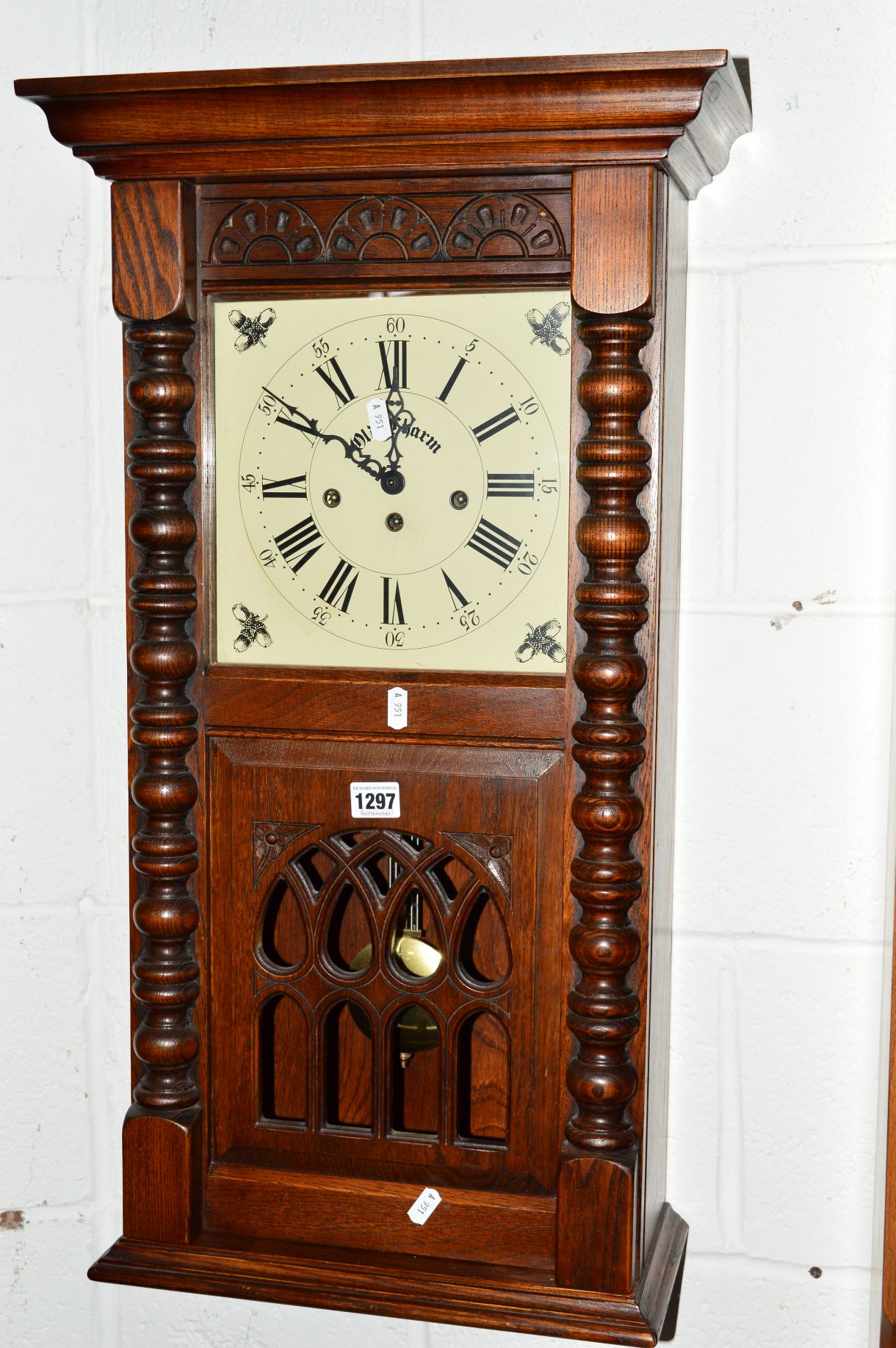 AN OLD CHARM OAK WALL CLOCK