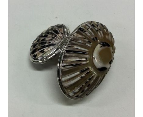 An 18th Century silver mounted cowrie shell snuff box. Approx. 39 grams. Est. £300 - £400.