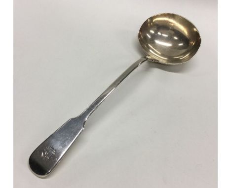 A large fiddle pattern silver soup ladle. London. By WE. Approx. 241 grams. Est. £100 - £150.