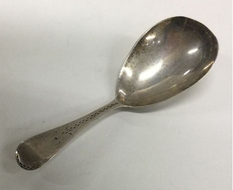 A finely engraved silver caddy spoon. Birmingham 1825. Possibly by John Lawrence? Approx. 10 grams. Est. £60 - £80.