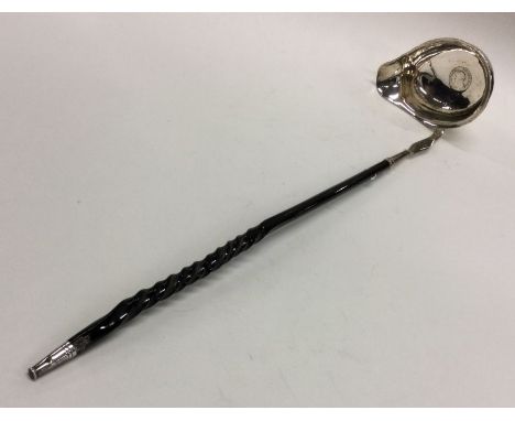 A good Georgian silver toddy ladle with whalebone handle. Approx. 51 grams. Est. £30 - £40.