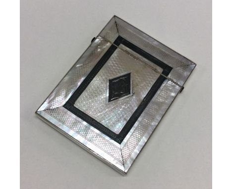 A good quality silver and MOP card case with engine turned decoration. Approx. 55 grams. Est. £40 - £50.