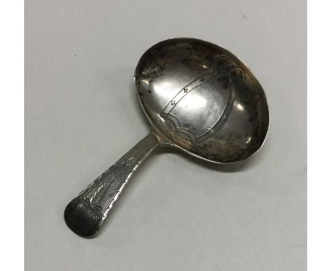 A good Georgian silver caddy spoon with bright cut decoration. Birmingham. By IT. Approx. 7 grams. Est. £50 - £80.