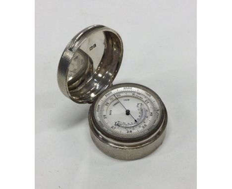 A rare and unusual cased silver barometer. London 1914. By William Frederick Williams. Approx. 134 grams. Est. £350 - £400.