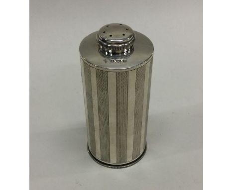 A good quality engine turned silver sugar caster of cylindrical form. Birmingham. Approx. 164 grams. Est. £140 - £160.