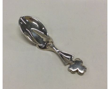 An unusual modernist silver caddy spoon with leaf handle. Approx. 22 grams. Est. £30 - £40.