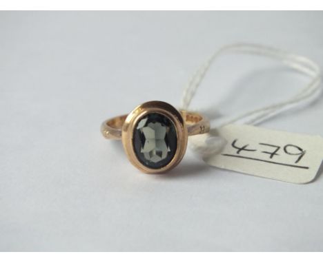 Oval green stone ring set in 9ct 