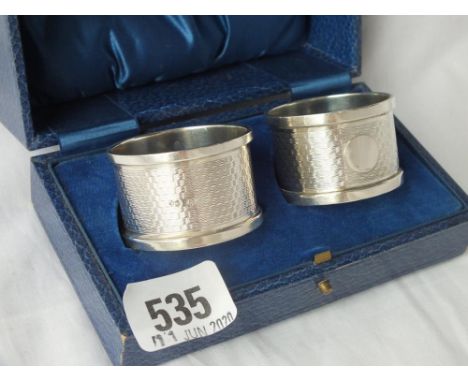 Boxed pair of engine turned napkin rings with vacant cartouche - B'ham 1927