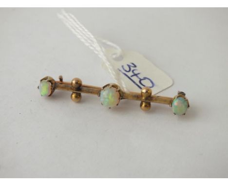 Three stone opal bar brooch set in 15ct gold