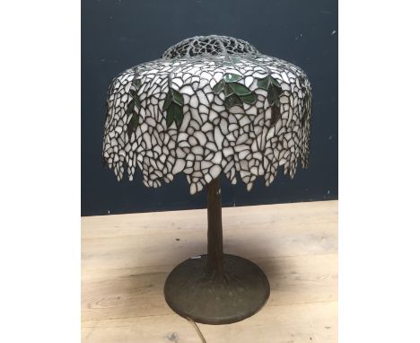 Tiffany style  glass and lead lined lamp on a patinated metal base, with some damage  PLEASE always check condition PRIOR to 