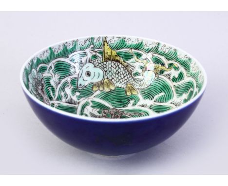 AN 18TH CENTURY KANGXI PERIOD CHINESE FAMILLE VERTE &amp; POWDER BLUE FISH &amp; CRAB BOWL, the interior of the bowl with dec
