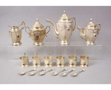 A LARGE SILVER PERSIAN TEA SET WITH KUWAITI EMBLEM, comprising six small cups, 6.5cm, tea pot, 22cm, coffee pot, 17cm, a suga