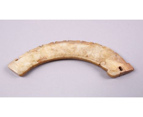 A GOOD WARRING STATES STYLE CARVED JADE HUANG PENDANT, of chilong form, 11cm.