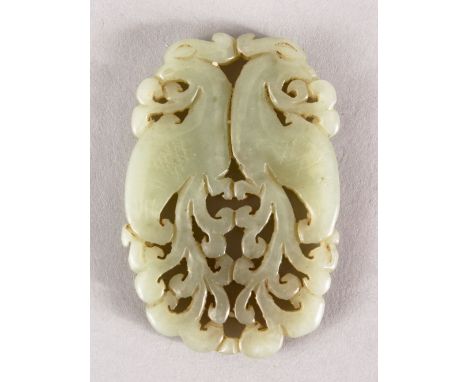 A GOOD 19TH / 20TH CENTURY CHINESE CARVED CELADON JADE PENDANT OF TWO PEACOCKS, two opposing peacocks, 6cm.