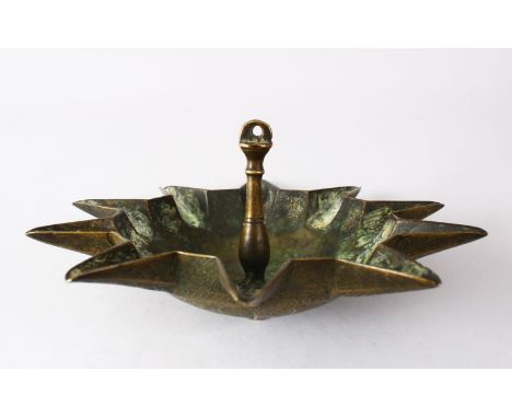AN UNUSUAL 19TH CENTURY OR EARLIER ISLAMIC BRASS HANGING OIL LAMP, the underside with chased decoration, 26cm.
