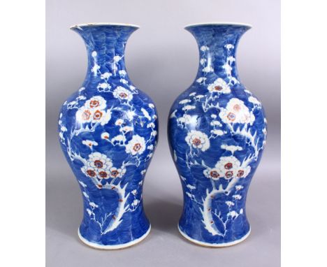 A PAIR OF 19TH CENTURY CHINESE BLUE &amp; WHITE PORCELAIN PRUNUS VASES, each with prunus decoration, the bases with six chara