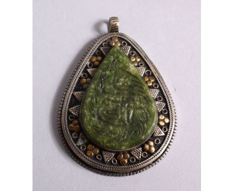 A GOOD ISLAMIC CARVED JADE SEAL &amp; WHITE METAL PENDANT, the jade carved with calligraphy and fixed to a white metal ( poss