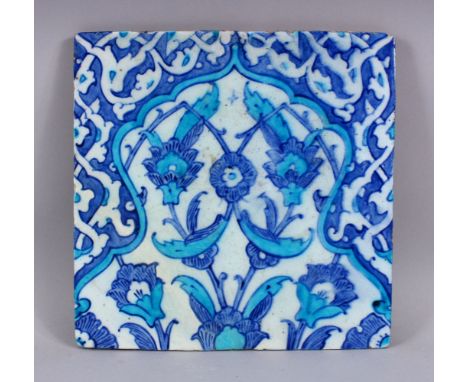 A GOOD TURKISH IZNIK TURQUOISE &amp; BLUE POTTERY TILE SECTION, the tile with finely executed decoration formal floral motif,