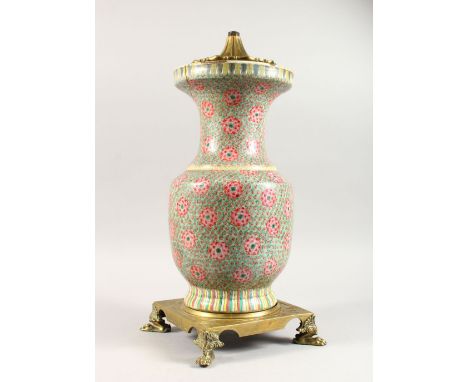 A 19TH CENTURY CHINESE FAMILLE ROSE PORCELAIN VASE / LAMP - ORMOLU MOUNTS, the vase decorated with profuse display of flora, 