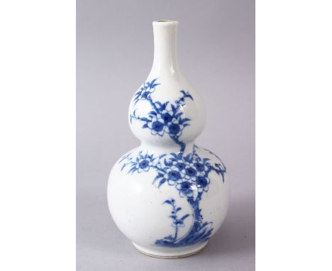 A CHINESE BLUE &amp; WHITE PORCELAIN DOUBLE GOURD SHAPED VASE, (af) , the base with a six character kangxi, 14cm.