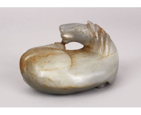 A CHINESE 19TH / 20TH CENTURY CARVED JADE FIGURE OF A DOUBLE STANDING RECUMBENT HORSE, 10cm high.