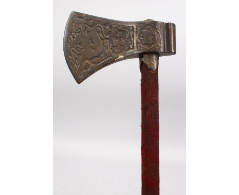 A FINE 18TH / 19TH CENTURY INDO PERSIAN ENGRAVED TABARZIN AXE, handle terminal has a concealed dagger, with animal engravings
