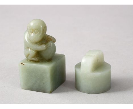 TWO GOOD CHINESE CARVED JADE SEALS, one depicting a monkey crouched amongst his nut, the base carved with characters, 4cm hig