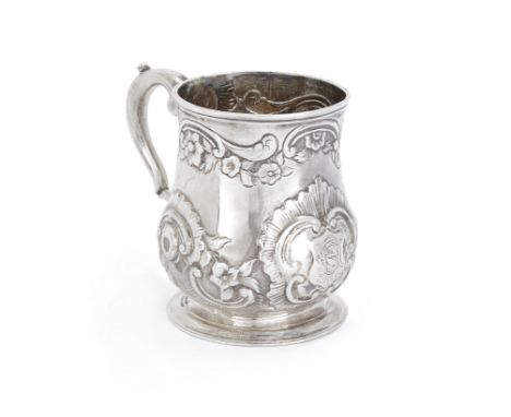 A George II silver mug. Thomas Mason, London, 1748.The baluster body later repousse decorated with flowers and scrolls, the c