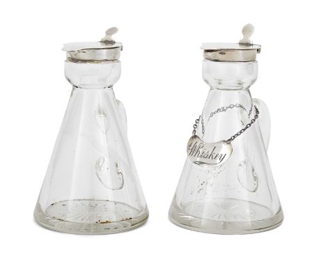 A pair of George V silver mounted whisky noggins. Asprey & Co., Birmingham, 1915. The tapering glass bodies to silver collars