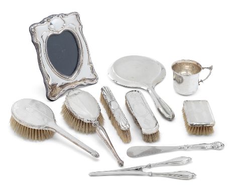 A George V silver cup. Barker Brothers, Chester, 1911. The handle decorated with foliate motifs and acorn thumbpiece to plain