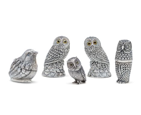 A pair of novelty owl salt and pepper shakers. Stamped 800. Realistically modelled standing atop a rock and designed with yel