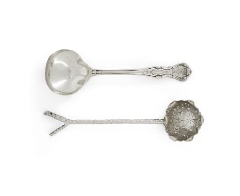 An Edwardian Arts & Crafts silver sifting spoon. Hukin & Heath,Birmingham, 1908. Designed with a twig-shaped handle with fork