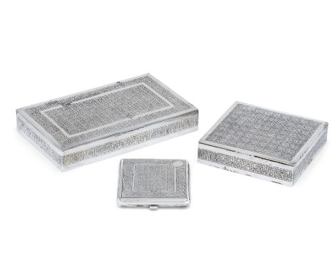 Two Iranian (Persian) silver cigarette boxes.20th century.Decorated with engraved quatrefoil lattice pattern, the largest box