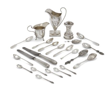 A group of silver items and flatware. Various dates and makers. The group including: a cream jug, Birmingham, 1945, Fattorini